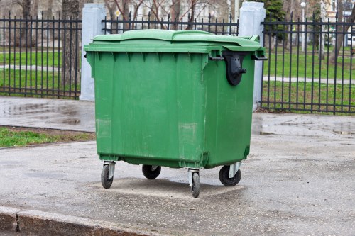 People disposing of furniture in Lambeth recycling center